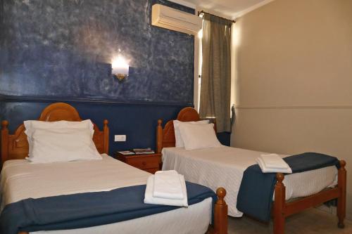 Postel nebo postele na pokoji v ubytování Guest House Sao Filipe