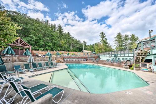 a swimming pool with lounge chairs and a building at Modern Mtn Home*Pools*Fire Pit* in Campton