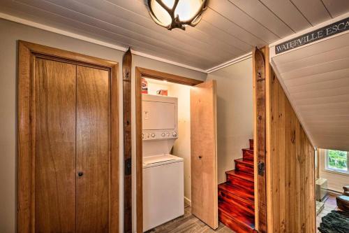 a kitchen with a refrigerator and a staircase in a house at Modern Mtn Home*Pools*Fire Pit* in Campton