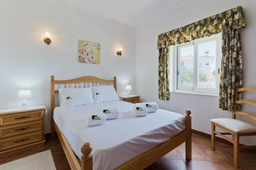 Katil atau katil-katil dalam bilik di BmyGuest - Lagoa Beach & Pool Villa