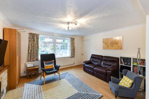 a living room with a couch and a chair at Lambourne House in Nottingham