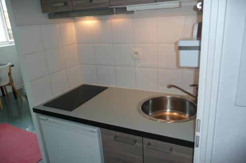 Kuhinja oz. manjša kuhinja v nastanitvi Appartement dans Toulouse Hyper centre
