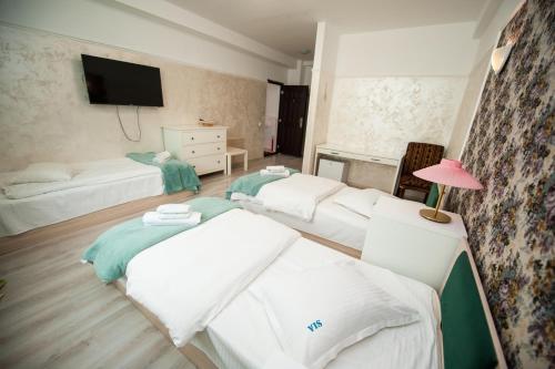 Ένα ή περισσότερα κρεβάτια σε δωμάτιο στο SIA Residence