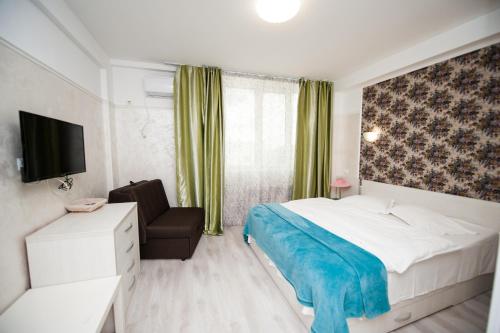 Ένα ή περισσότερα κρεβάτια σε δωμάτιο στο SIA Residence