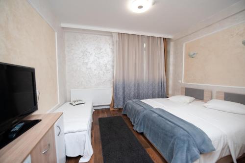 Ένα ή περισσότερα κρεβάτια σε δωμάτιο στο SIA Residence