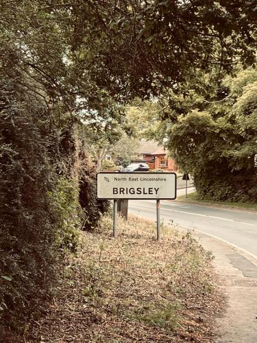 a street sign on the side of a road at Prelude Guesthouse, Brigsley Grimsby in Grimsby