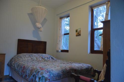 A bed or beds in a room at Daphne House