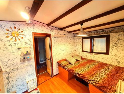 a bedroom with two beds in a room at LA VILLETTA DI MR MAX in Merone