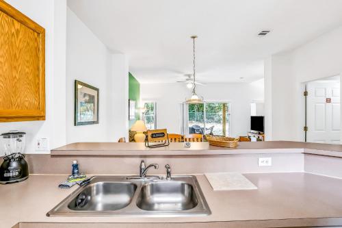 a kitchen with a sink and a counter top at Bright & Breezy in Kissimmee