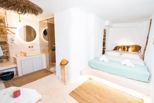 a bedroom with a bed and a bathroom at Private Pool Dame in Mési
