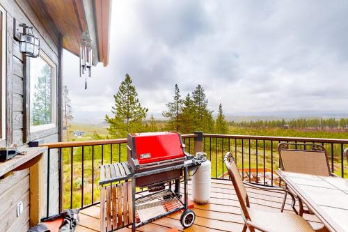 a screened in porch with a laptop on a cart at Tabernash Tranquility in Tabernash