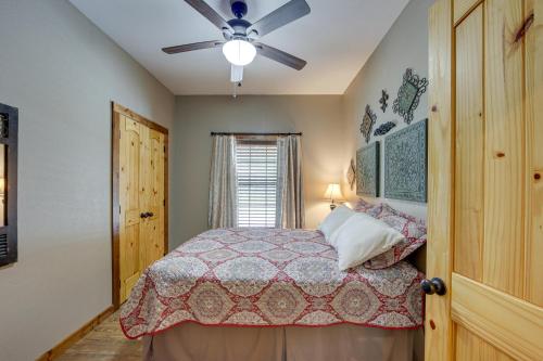 a bedroom with a bed and a ceiling fan at Jefferson Vacation Rental with Golf Cart! in Jefferson