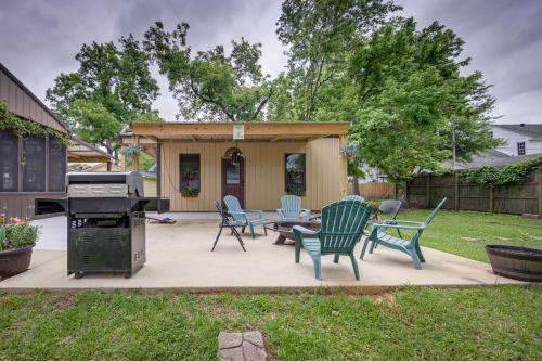 a backyard with a barbecue and chairs and a grill at Jefferson Vacation Rental with Golf Cart! in Jefferson