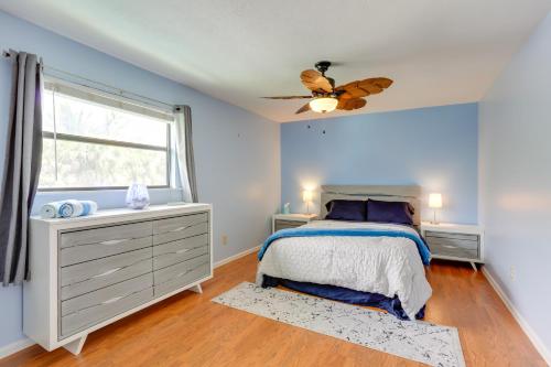 a bedroom with a bed and a window at Idyllic Fort Pierce Retreat - Walk to Beach! in Fort Pierce