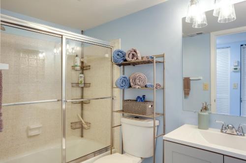 a bathroom with a shower and a toilet and a sink at Idyllic Fort Pierce Retreat - Walk to Beach! in Fort Pierce
