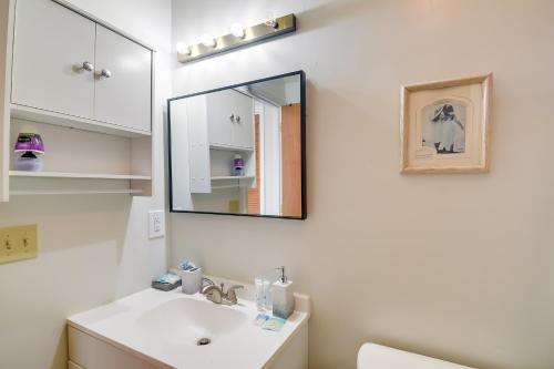 a bathroom with a sink and a mirror at Baytree Golf Colony Studio about 5 Mi to Beach! in Little River