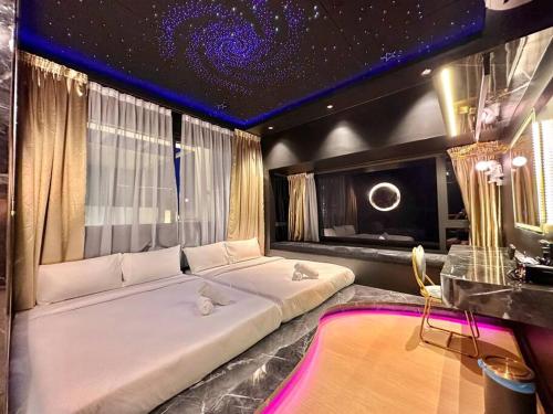 a bedroom with a large white bed in a room at MWHolidayA2713{SkyGalaxy}PrivateJacuzzi@SeaVilla in Melaka