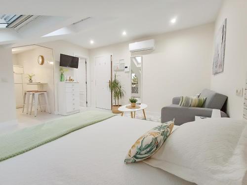 Ένα ή περισσότερα κρεβάτια σε δωμάτιο στο Coqueto estudio en Sanxenxo