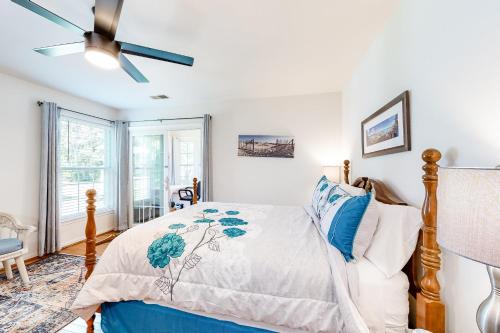a bedroom with a bed and a ceiling fan at Octopus Pond Paradise in Ocean City