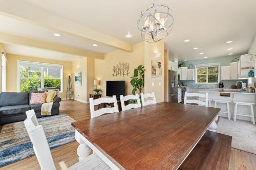 a dining room and living room with a table and chairs at Beaches and Breezes on Wapato - 4 Bed 4 Bath Vacation home in Wapato Point in Manson