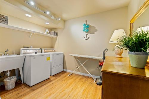 a kitchen with a sink and a dishwasher at Beaches and Breezes on Wapato - 4 Bed 4 Bath Vacation home in Wapato Point in Manson