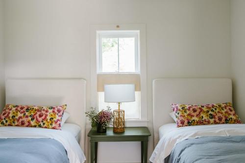 a bedroom with two beds and a window at The Wayback Boutique Hotel in Austin
