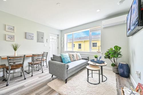 a living room with a couch and a table at 318 E Youngs Ave Unit 7 Salty Shore Retreat Coastal Charm Tranquility in Wildwood