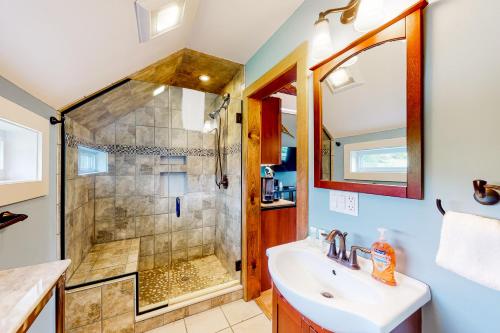 a bathroom with a shower and a sink at The Lodge - Suite #3 in Waterbury