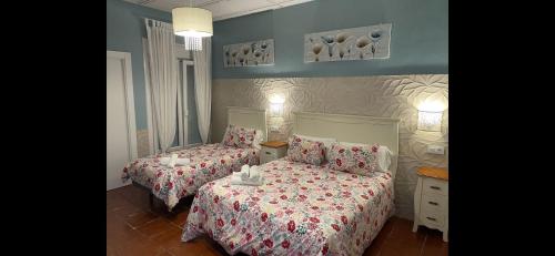 Posteľ alebo postele v izbe v ubytovaní Hostal El Puerto Boutique