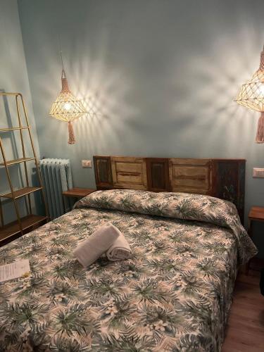 a bedroom with a bed with a pillow on it at Hotel Nice in Viareggio