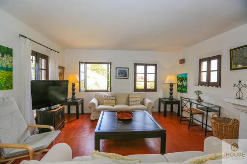 a living room with a couch and a tv at SANTA URSULA 