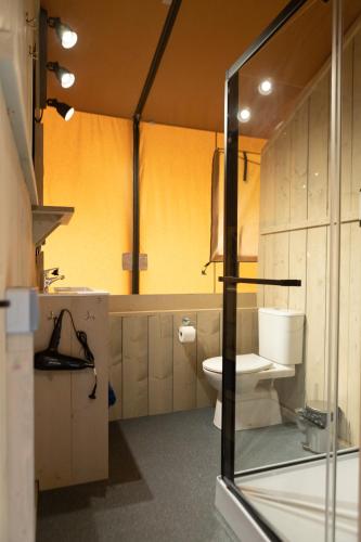a bathroom with a toilet and a sink at Camping Del Mar in Malgrat de Mar