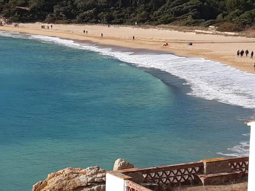 a view of a beach with people in the water at Casa Marinera en Palamós in Palamós