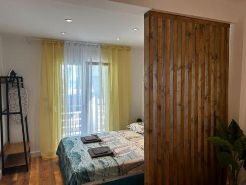 a bedroom with a bed and a large wooden closet at Sea Pleasure Studio in Perea