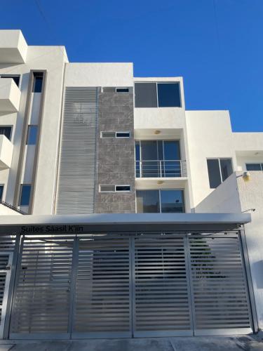 a building with a garage door in front of it at Centrico Depto (101) in Cancún