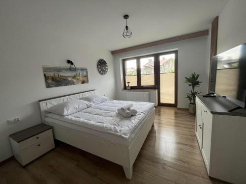 Ein Bett oder Betten in einem Zimmer der Unterkunft Apartamenty Wadowity- Energylandia Zator