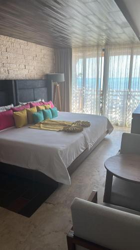 Postel nebo postele na pokoji v ubytování Hotel Beló Isla Mujeres - All Inclusive - Sargassum Free