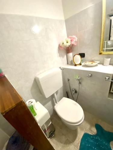 a bathroom with a white toilet and a sink at Appartamento nel cuore di Camogli 010007-LT-0594 in Camogli
