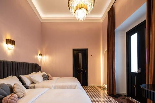 Ένα ή περισσότερα κρεβάτια σε δωμάτιο στο HOLT Hotel De Mi Independencia Double Queen Room