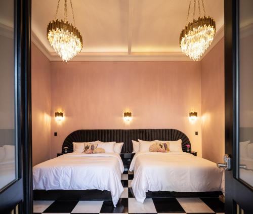 Ένα ή περισσότερα κρεβάτια σε δωμάτιο στο HOLT Hotel De Mi Independencia Double Queen Room