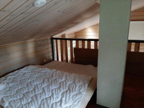 a bedroom with a bed in a attic at Villa Ulappa in Savonlinna