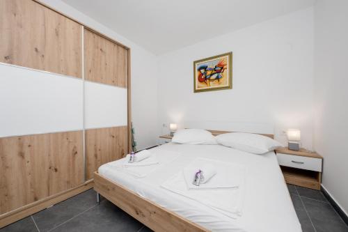 Posteľ alebo postele v izbe v ubytovaní Mariva Apartments