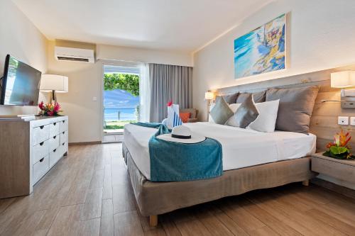 Una cama o camas en una habitación de Grand Case Beach Club