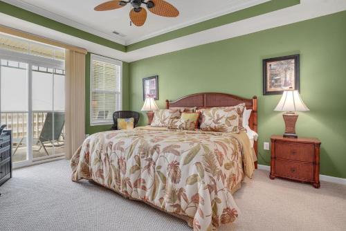 a bedroom with a bed and a ceiling fan at Sunset Island Luxury 3BR Unit – Free Linen Package in Ocean City