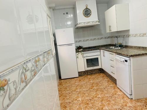 Η κουζίνα ή μικρή κουζίνα στο Apartamentos custodio