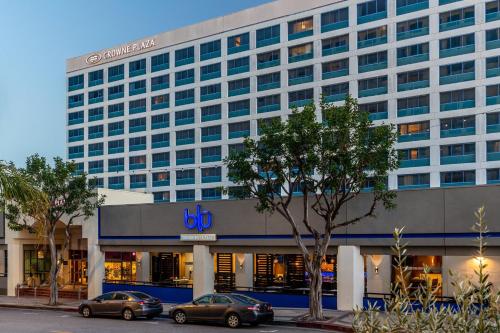 a large building with cars parked in front of it at Crowne Plaza Hotel Los Angeles Harbor by IHG in San Pedro