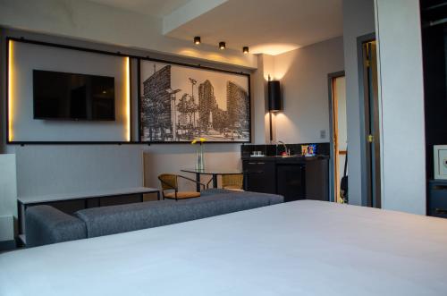 Ένα ή περισσότερα κρεβάτια σε δωμάτιο στο Royal Golden Hotel - Savassi