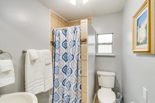 a bathroom with a toilet and a shower curtain at Keystone Heights Vacation Rental On the Lake! in Keystone Heights