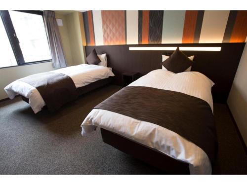 Postel nebo postele na pokoji v ubytování HOTEL LANTANA OSAKA - Vacation STAY 44970v