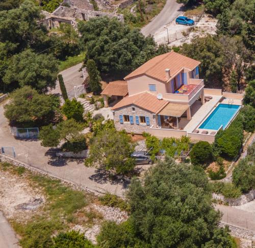 an aerial view of a house with a swimming pool at Villa Apollo up to 8px, private pool in Fiskardho